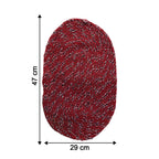 Close-up of red floor mat showing textured fabric