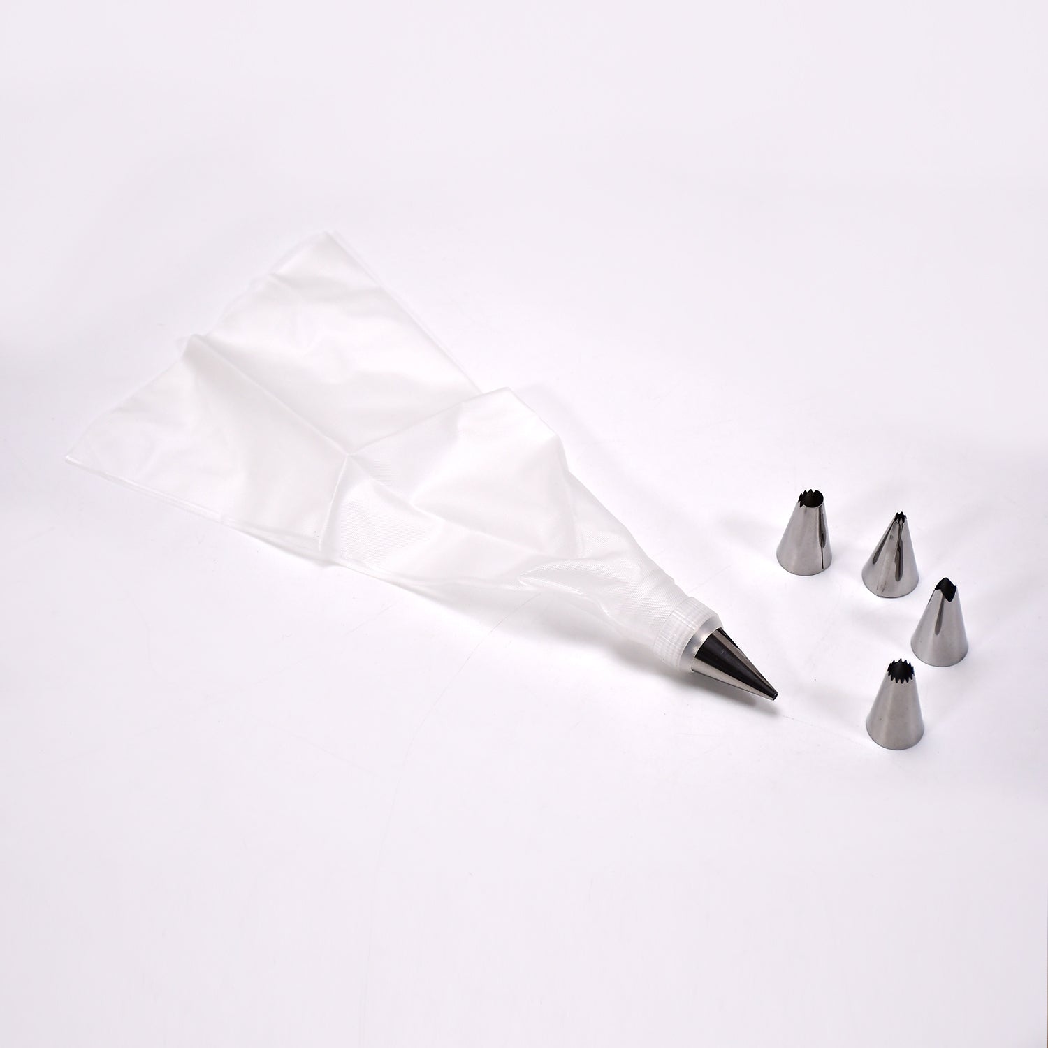 A collection of stainless steel piping nozzles for intricate cake and cupcake decorations.