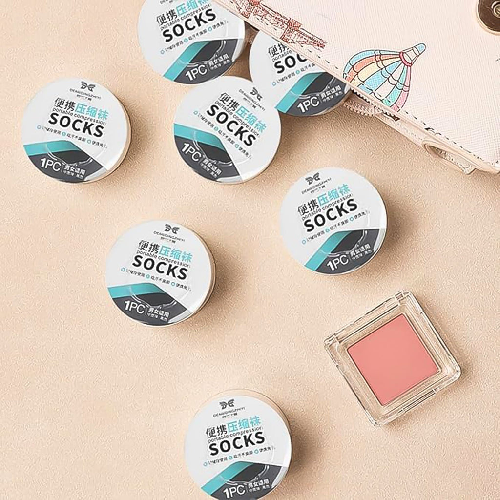 Disposable travel socks displayed to show their lightweight and thin design.