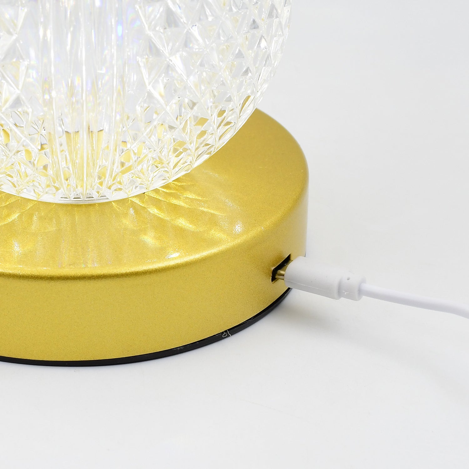 Rechargeable LED table lamp casting a warm glow on a bedside table.