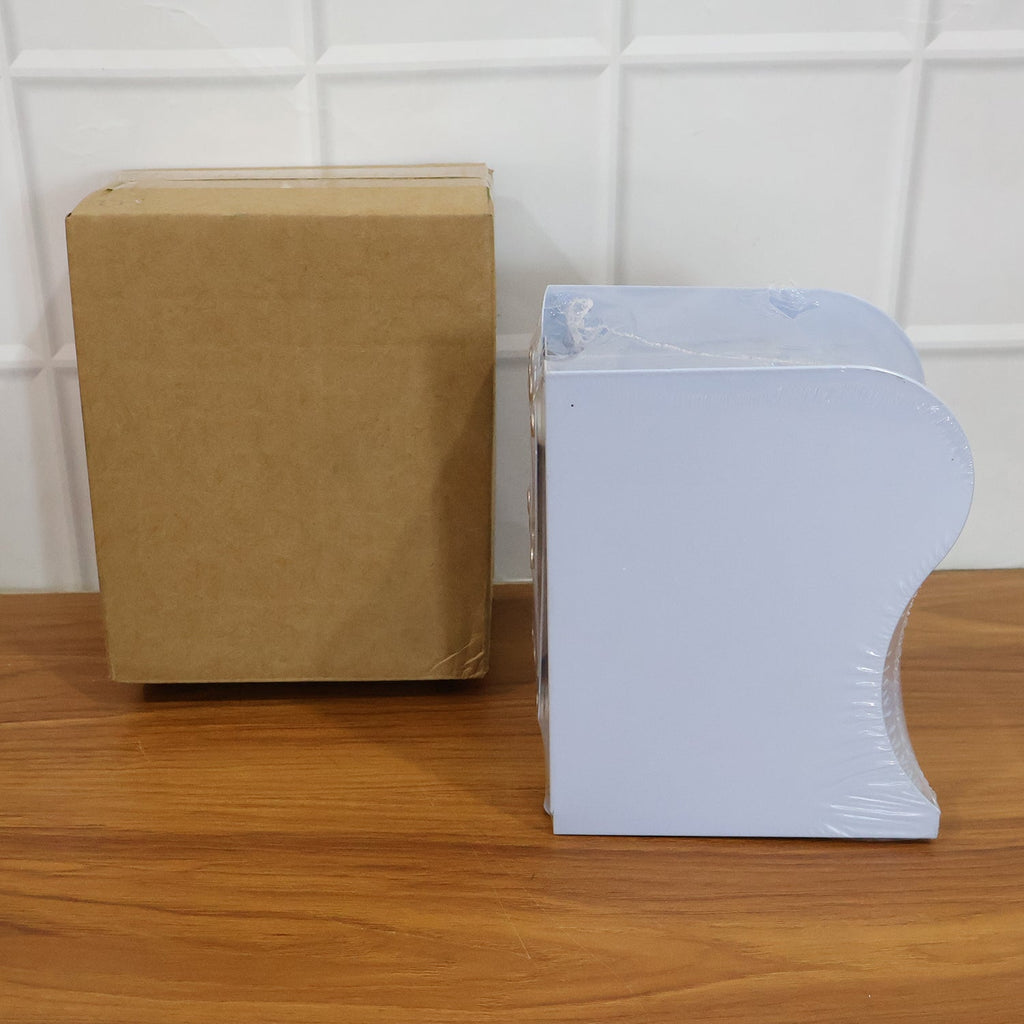 Expandable book stand holding a single book upright on table