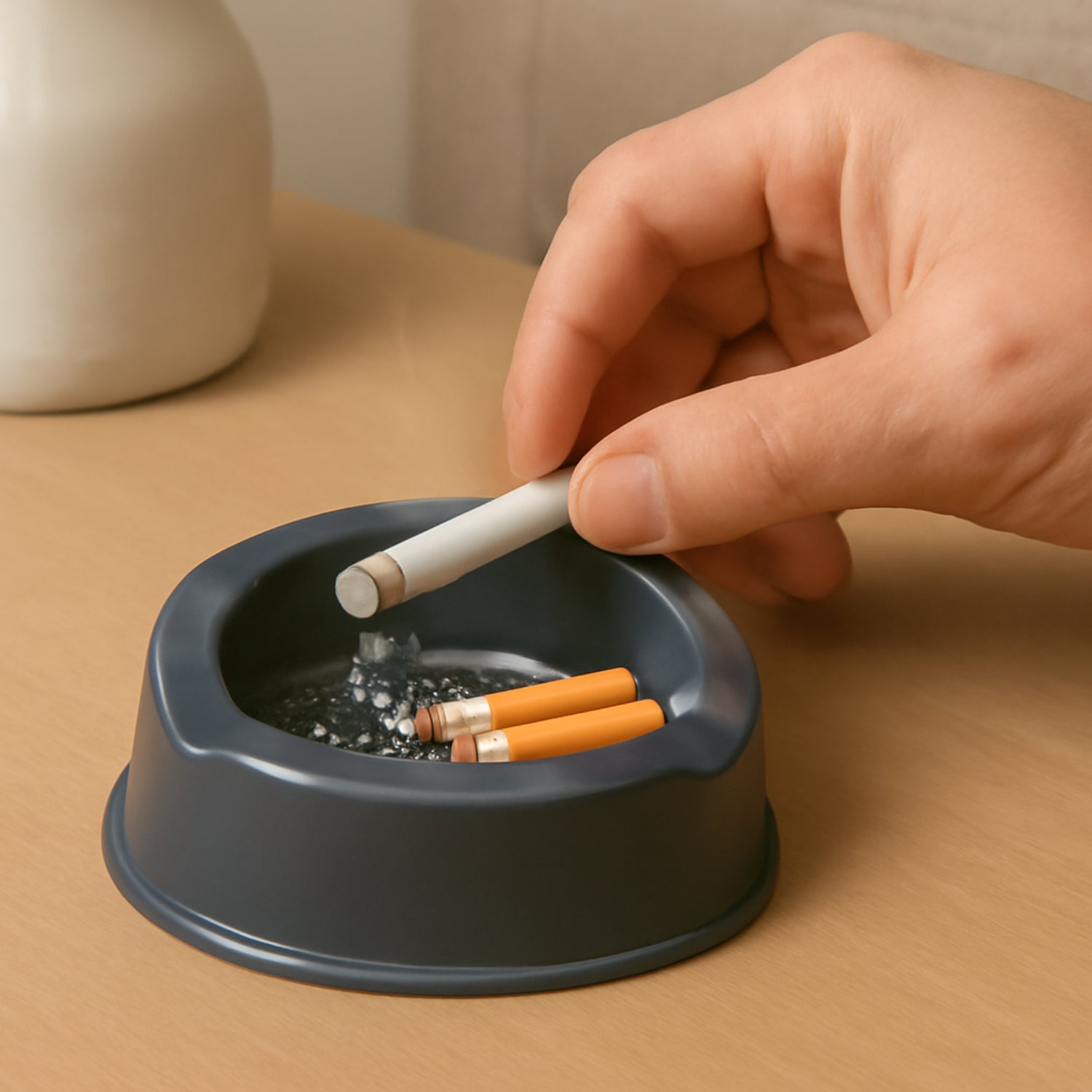 Durable grey plastic ashtray with wide bowl and triple cigarette slots
