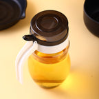 650ml plastic oil dispenser with sleek design for kitchen use.