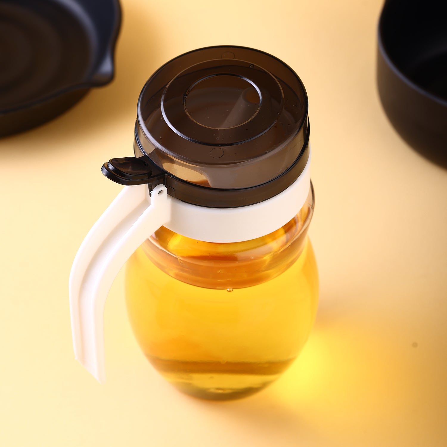650ml plastic oil dispenser with sleek design for kitchen use.