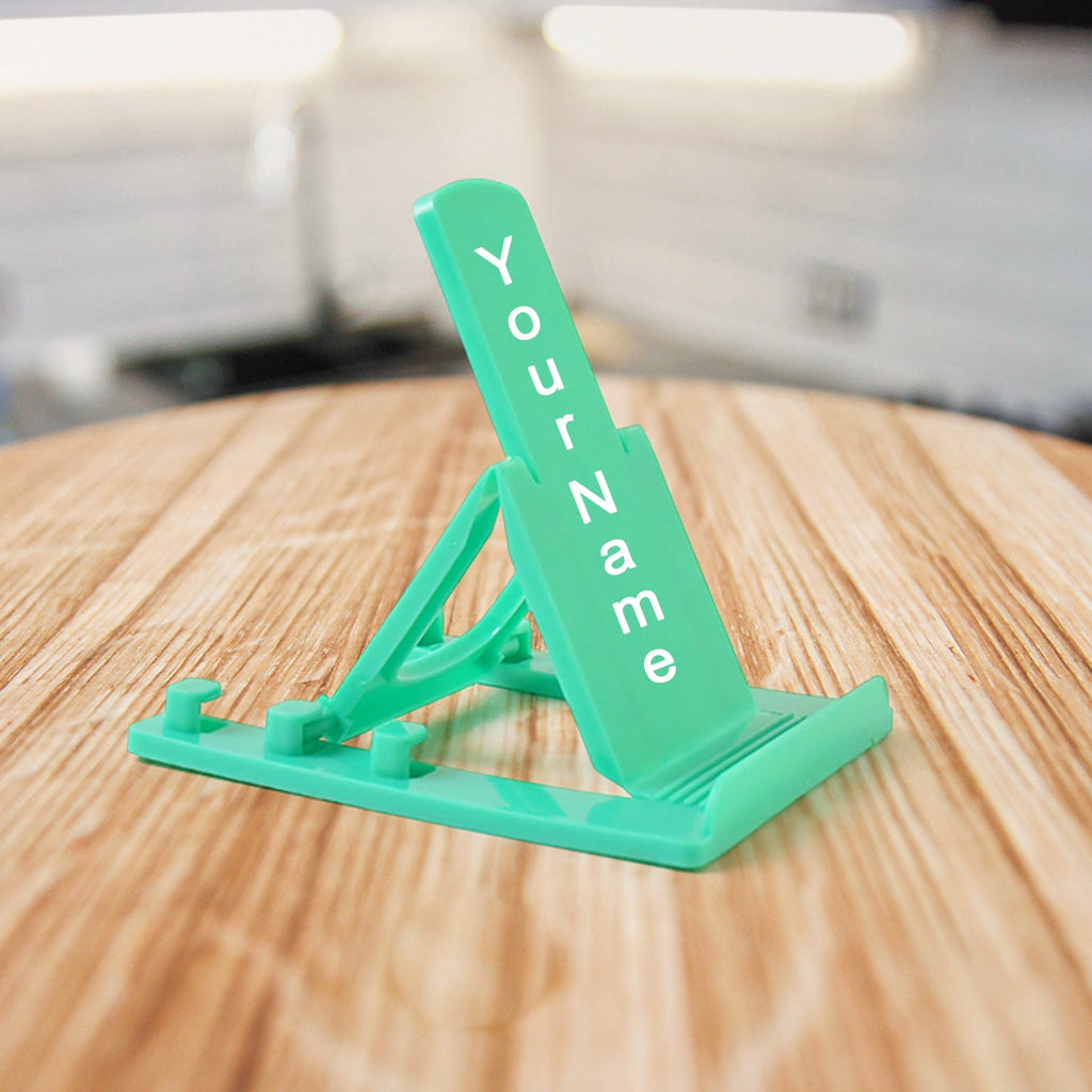 Sturdy plastic mobile phone stand with adjustable tilt in use