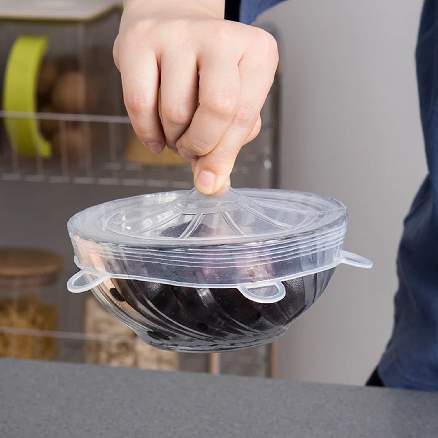 Six varying sizes of silicone stretch lids displayed flat.