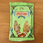 Hand displaying vibrant dried henna design after Herbal Mehndi Powder application