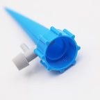 Multiple adjustable plant watering spikes connected and ready for use.
