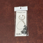 Display of durable metal Shivling keychain with snake design