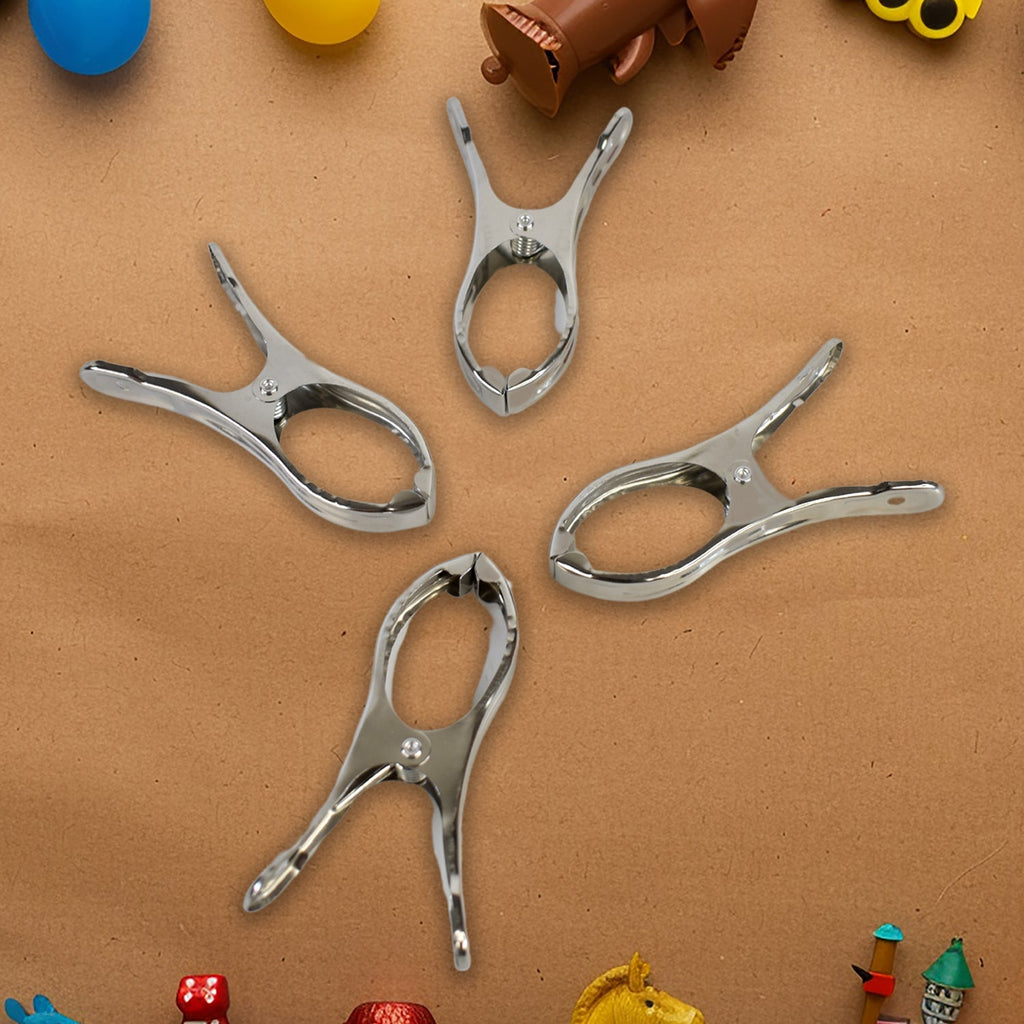 Durable stainless steel clothespins showcasing strong grip on towels.
