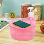 Transparent double-layer soap dispenser with sponge holder on a countertop.