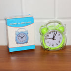 Portable compact quartz analog alarm clock in green transparent frame