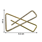 Close-up of golden crystal triangle brooch for scarf styling