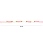 Pink & White Thread Rakhi on a hand