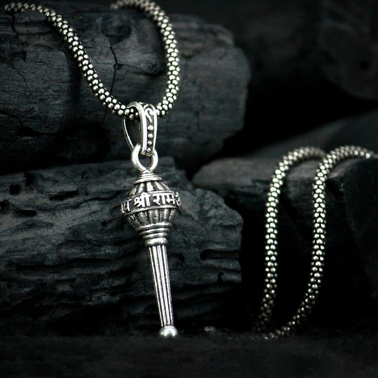Hanuman Gada Pendant necklace on a plain background, showcasing its silver finish.