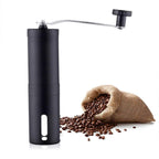 Siplix stainless steel manual coffee grinder displayed from a slightly elevated angle.
