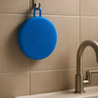 Versatile silicone scrubber functioning as a heat-resistant pot holder.