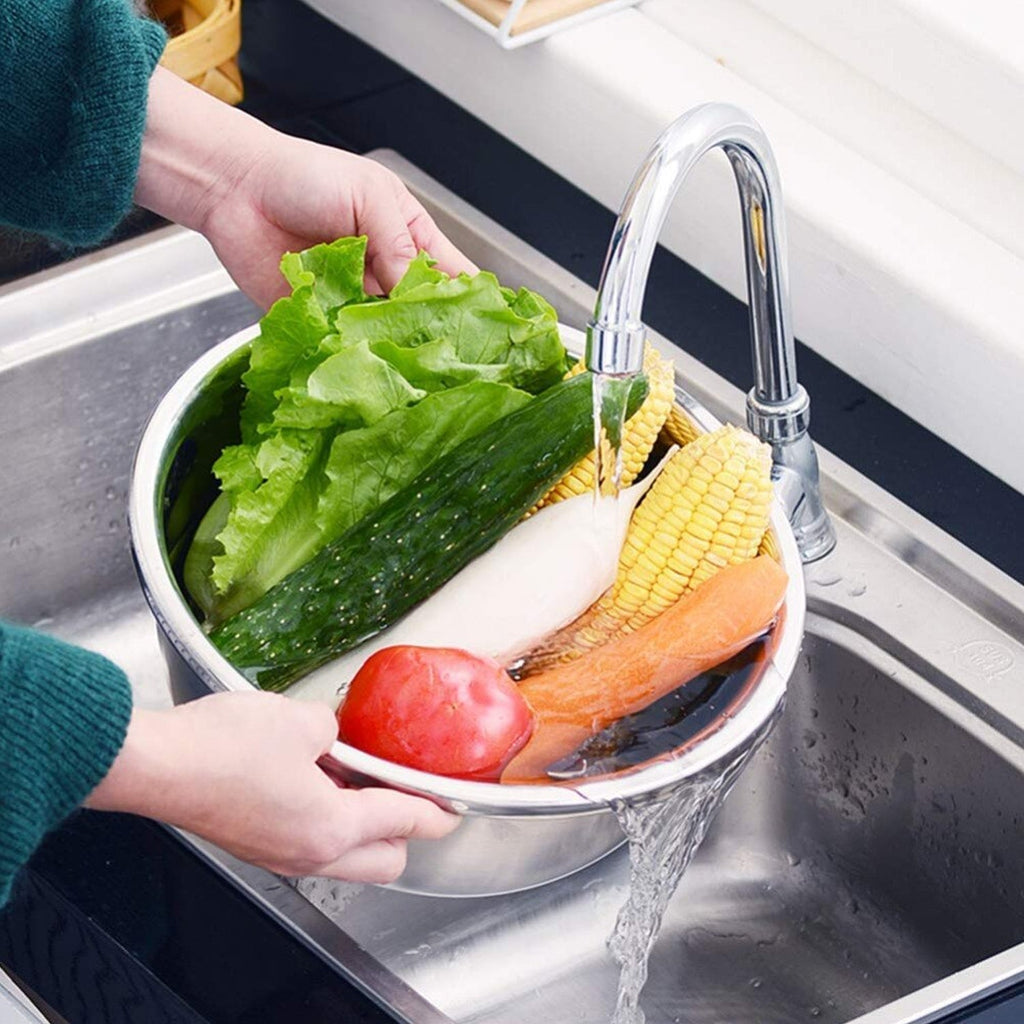 The stainless steel drain basket from the set, effectively straining washed vegetables or fruits.