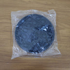 Back view of round silicone Pop It fidget toy for sensory play