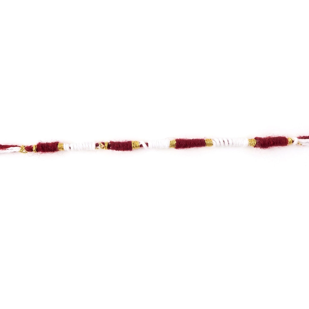 Red and white Mauli Rakhi with gold wire for traditional celebrations