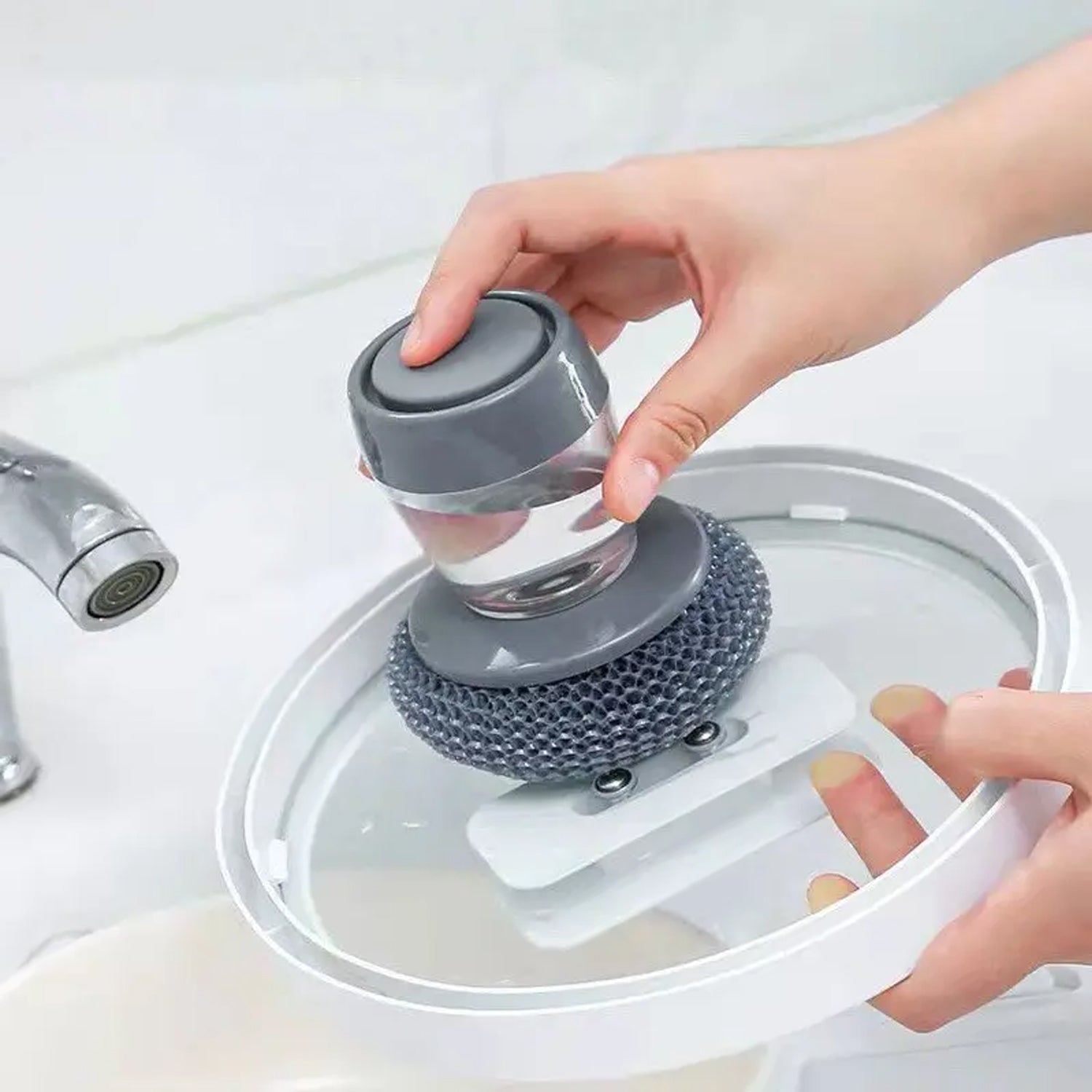 Ergonomic Soap Dispensing Dish Brush with clear soap reservoir for easy refilling.