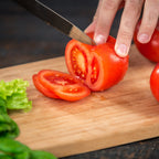 Smooth surface wooden board for hygienic food preparation.