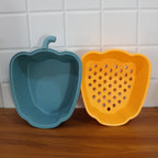 Top view showing perforations in pepper shape plastic colander strainer