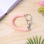 Key holder wristband featuring durable metal key ring attachment