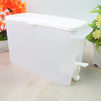 Slim water dispenser jug fitting perfectly inside a refrigerator, ready for use.