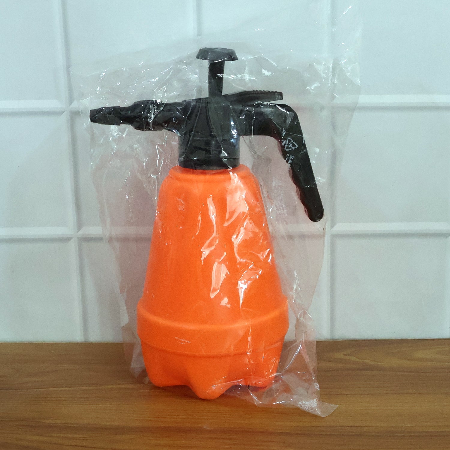 Side angle view of sturdy 1.5L pressure spray bottle with adjustable nozzle