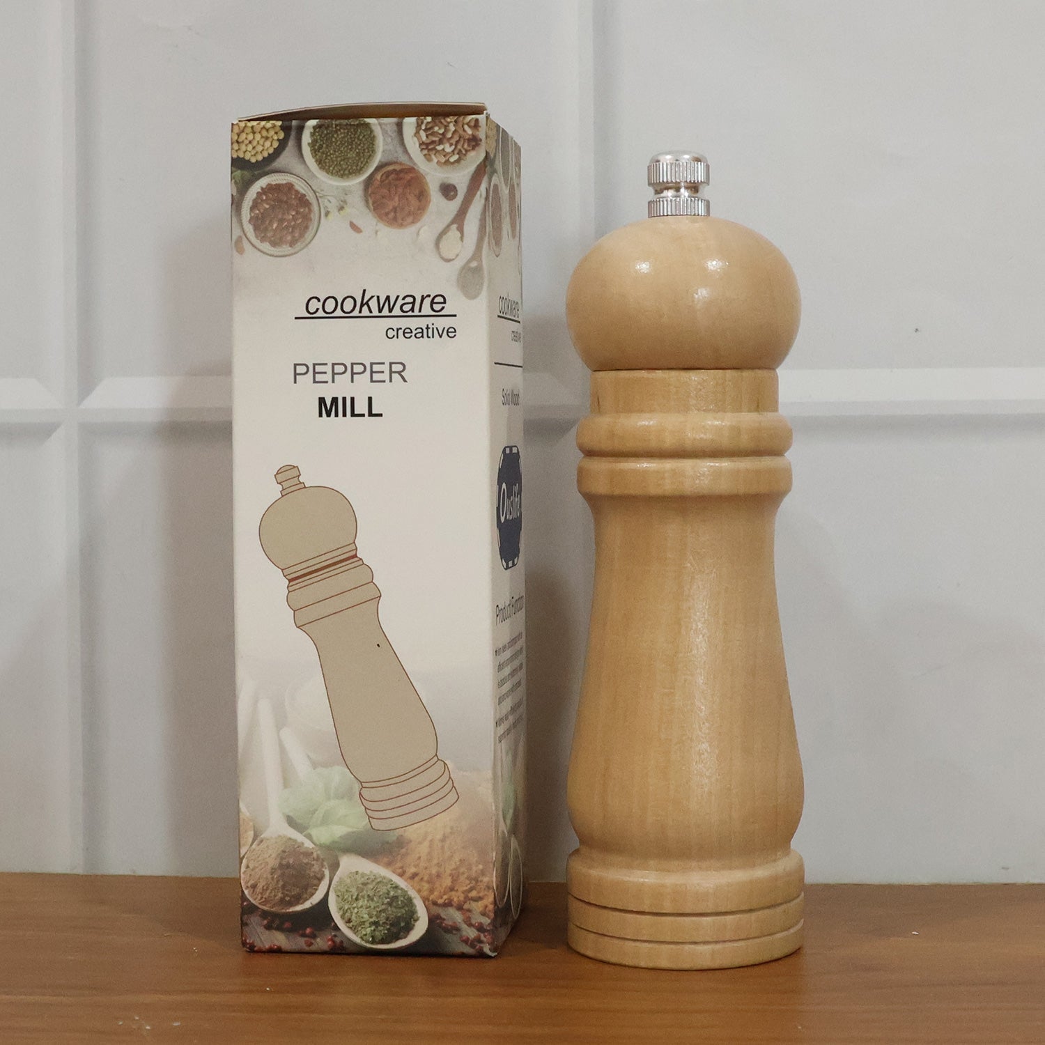 Compact wooden manual pepper mill for consistent spice grinding and seasoning