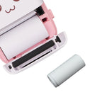 A hand holding a single Papezo thermal printer paper roll, emphasizing its portable size.