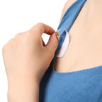 Fashion tape used to secure the neckline of a deep plunge dress.