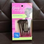 Close-up of the Ponytail Comb's wide teeth and integrated elastic, ready for use.
