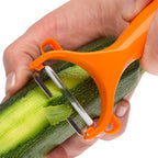 Close-up of a Y-shape vegetable peeler with a sharp stainless steel blade.