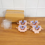 Four broom and mop holder clips mounted on wall organizing cleaning items