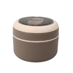 The Ganesh food container with spoon displayed on a table, emphasizing its complete meal solution.