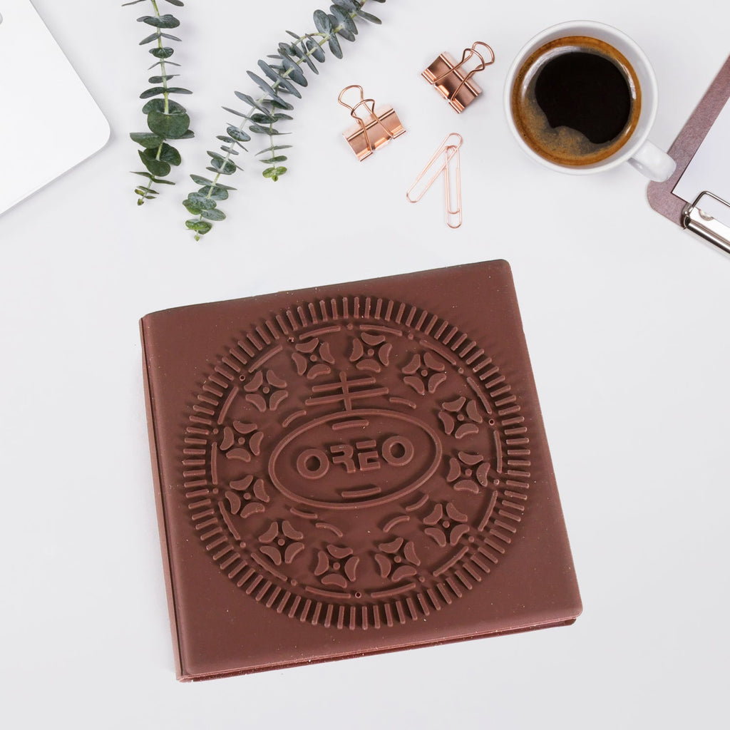 Open chocolate scented notebook displaying blank pages for writing.