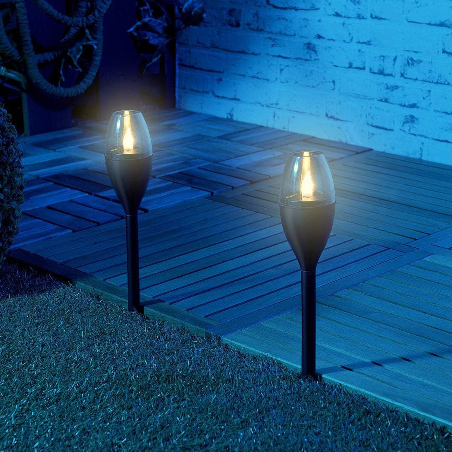 Solar-powered garden pathway light in black with transparent top