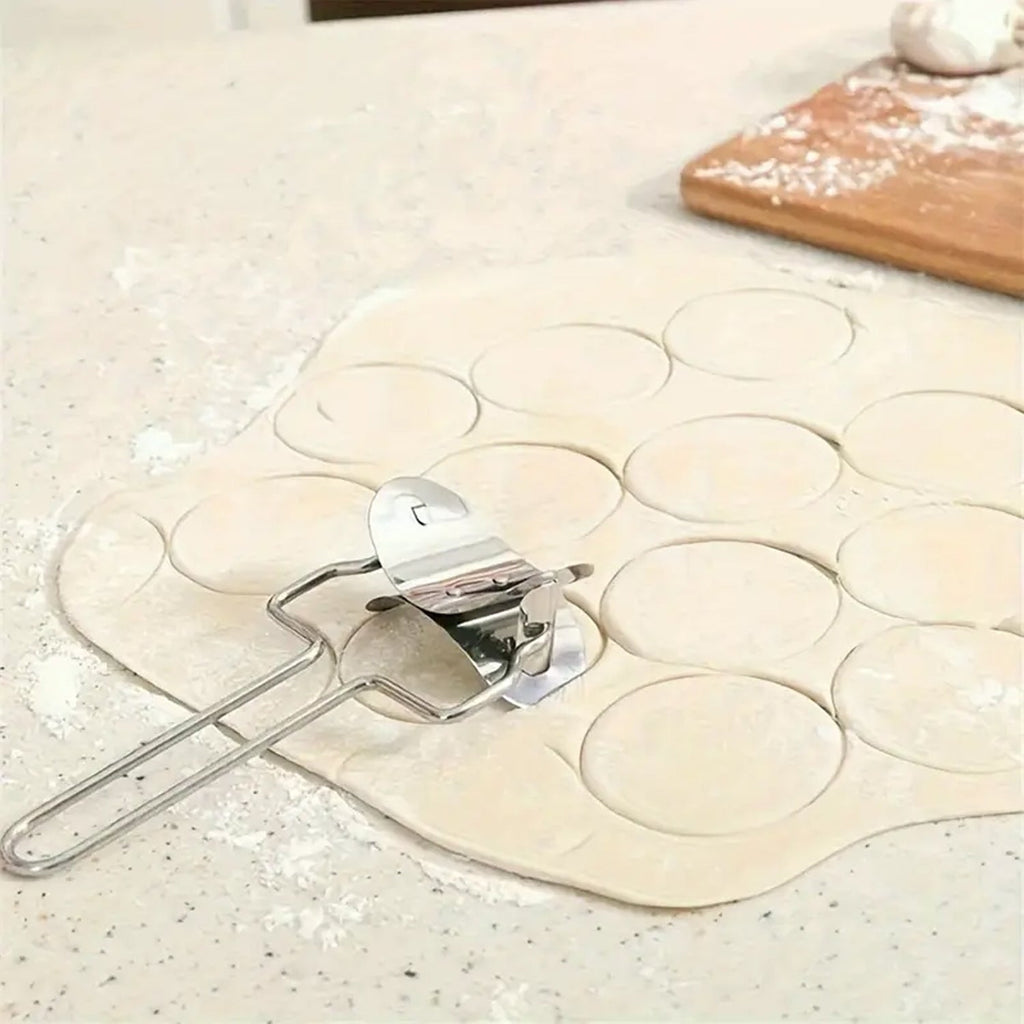 Stainless steel puri cutter roller shown alongside other baking and kitchen tools.