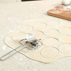 Stainless steel puri cutter roller shown alongside other baking and kitchen tools.