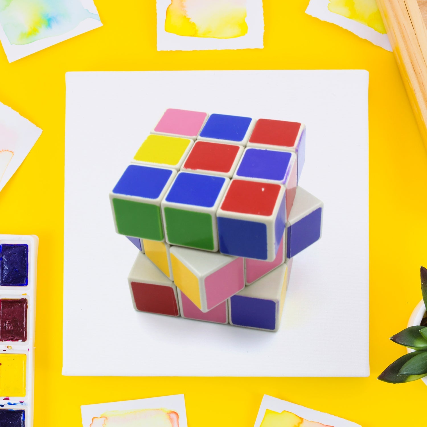 A child intently playing with a Rubik's Cube, developing logic and problem-solving skills through this educational toy.