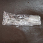 Straw and bottle cleaning brushes with loop handles arranged neatly on a surface