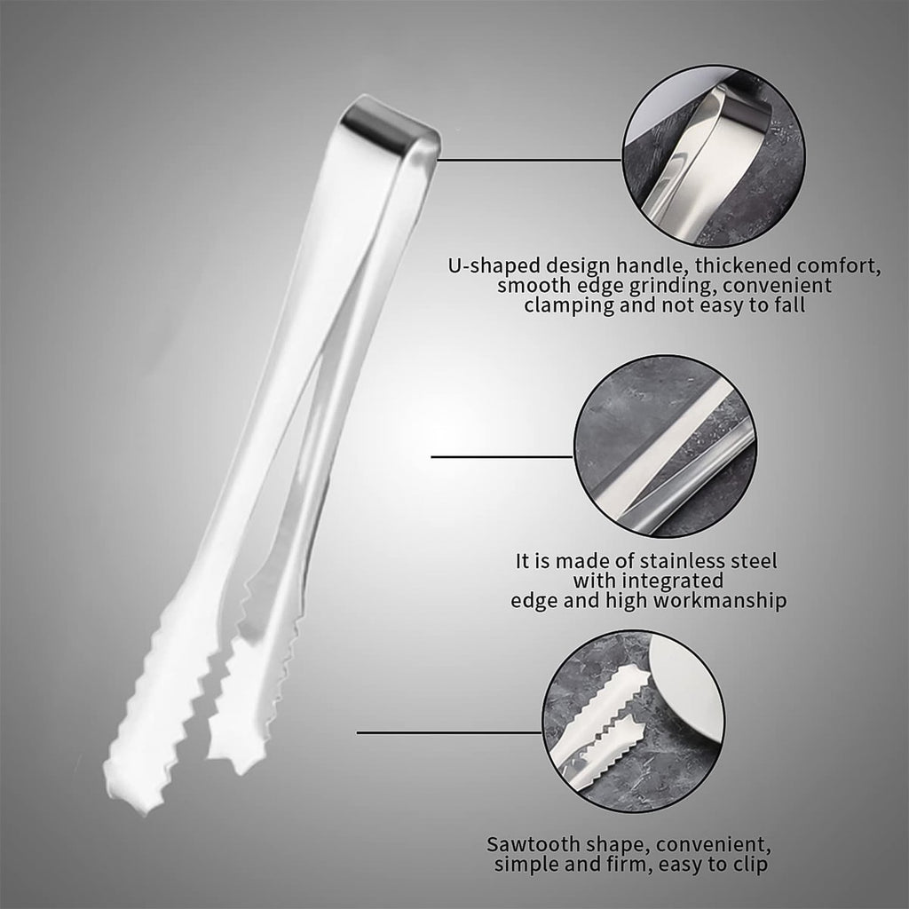 Set of two stainless steel serving tongs on a clear glass plate.