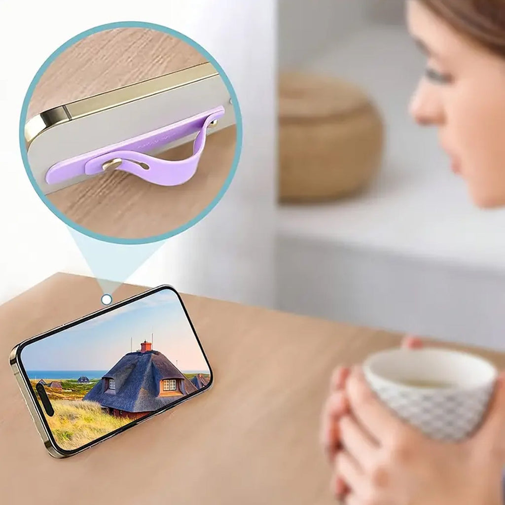 Person comfortably holding a phone with the silicone phone finger holder for enhanced one-handed use.