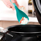 Close-up of a durable BPA-free plastic serving spoon with a smooth finish, ideal for kitchen use.