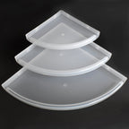 Side view of a sturdy white plastic corner shelf, ready for bathroom installation.