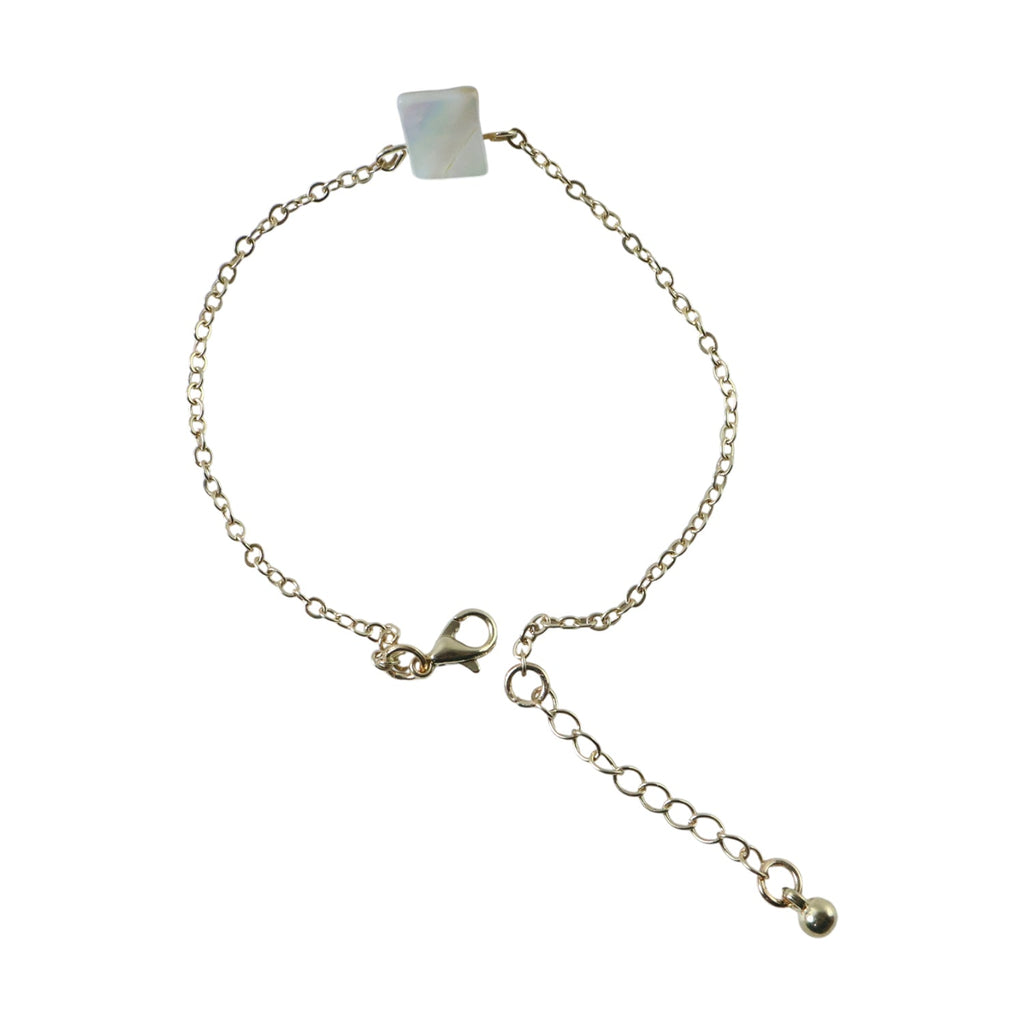 Detailed view of square stone charm on adjustable chain bracelet