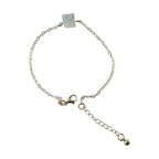 Detailed view of square stone charm on adjustable chain bracelet