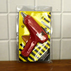 All components of the hot melt glue gun kit laid out.